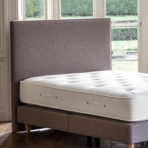 Plain contemporary headboard in grey fabric